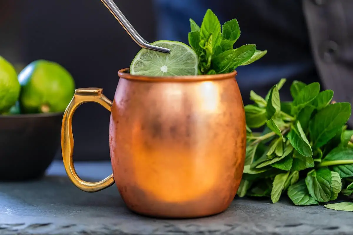 Mint julip cocktail in copper mug.