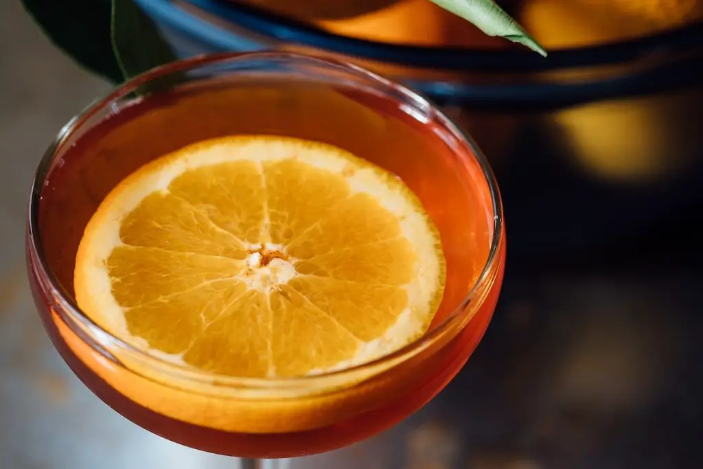 Sforzando cocktail with orange garnish